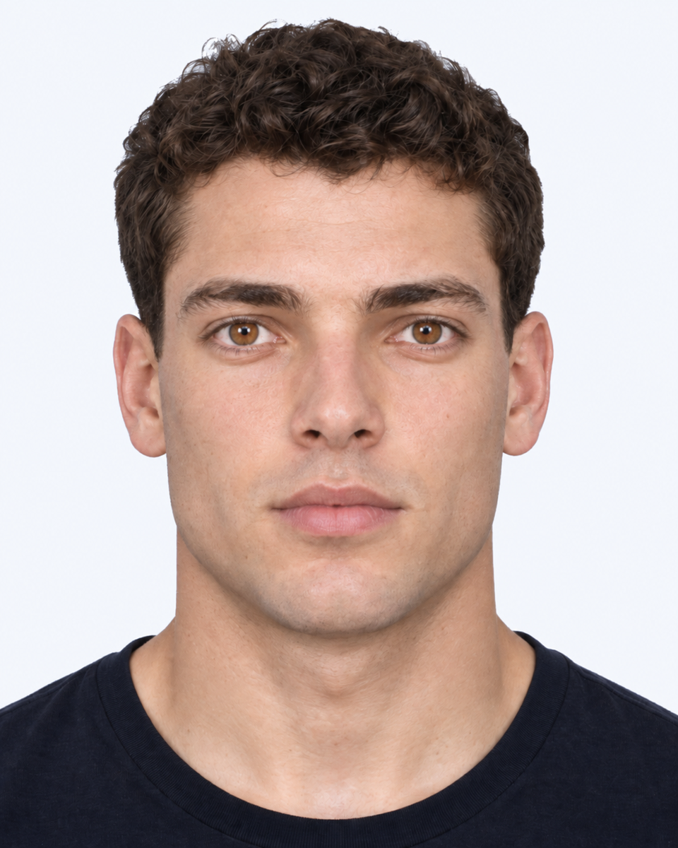 Same-person synthetic frontal portrait: The eyes sit farther apart relative to the cheekbone width.
